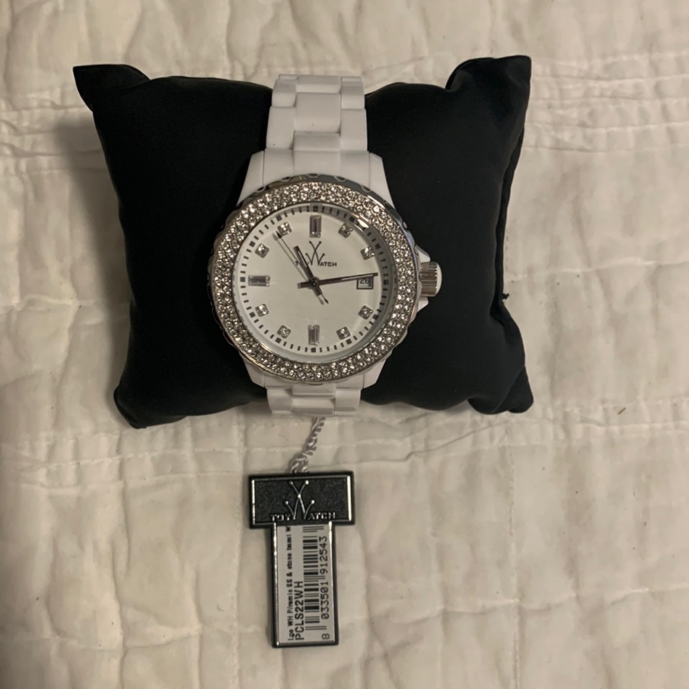 White  Toy Watch w/ “diamond” encrusted surround.